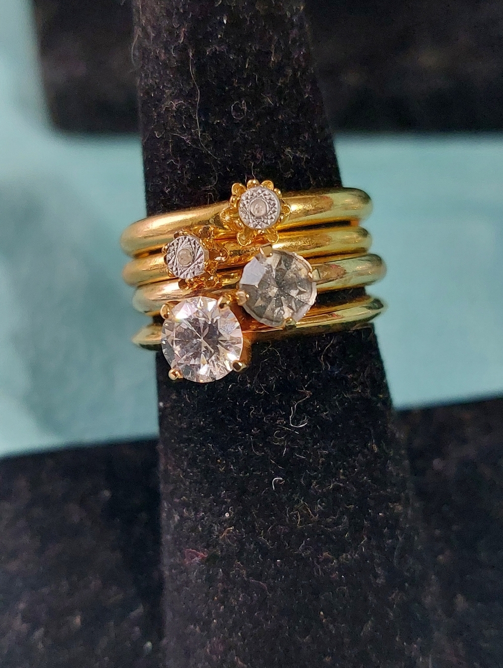 Four Rhinestone Goldtone Stackable Rings